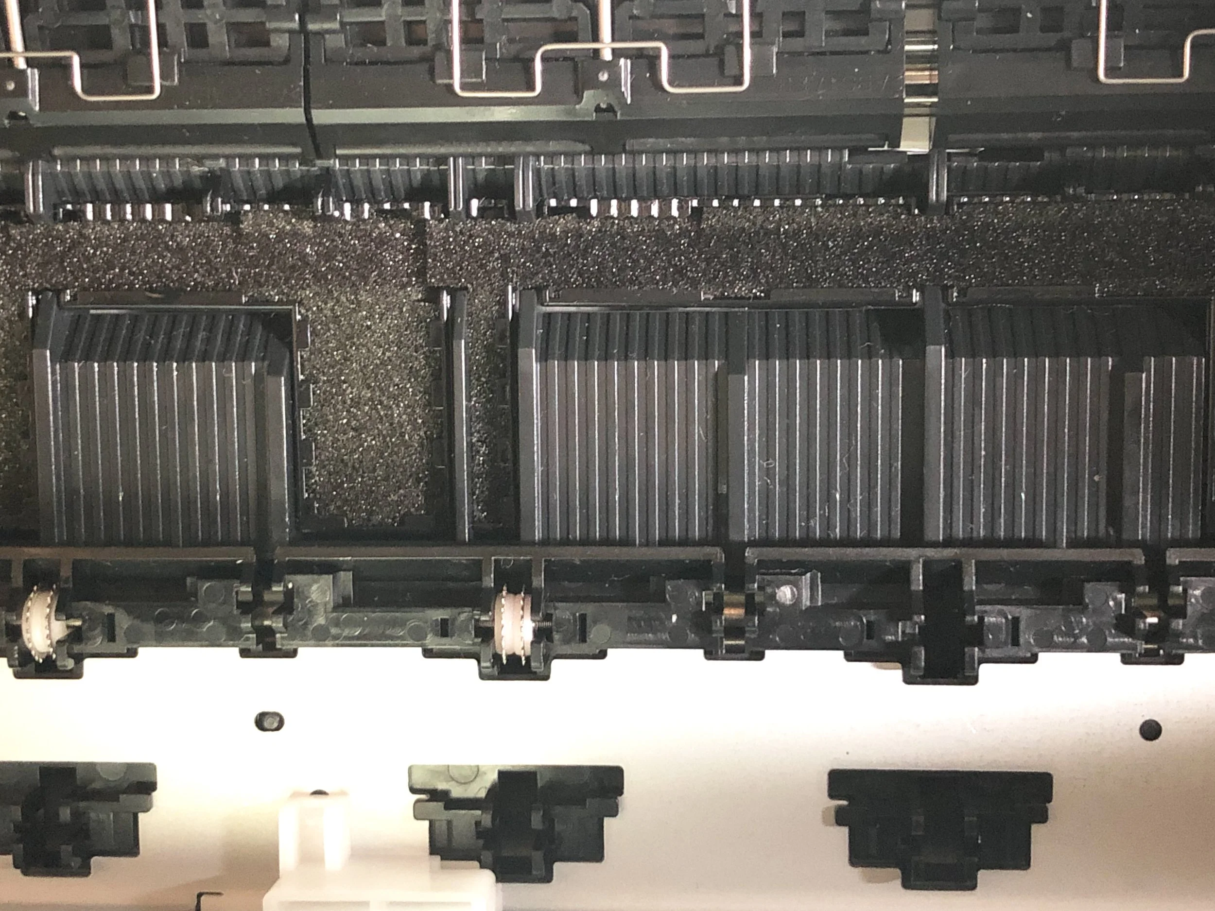 Two reinstalled rollers, with seven slots still empty. This step requires a LOT of patience.